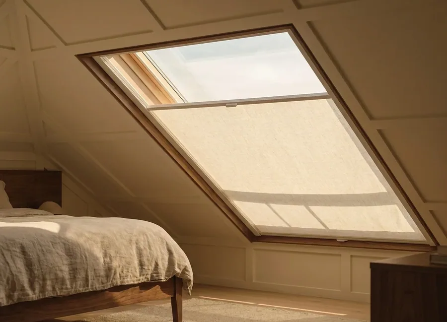 Blind fitted to a sloping skylight window in an upstairs bedroom